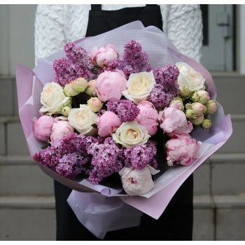 Bouquet of peonies and lilacs